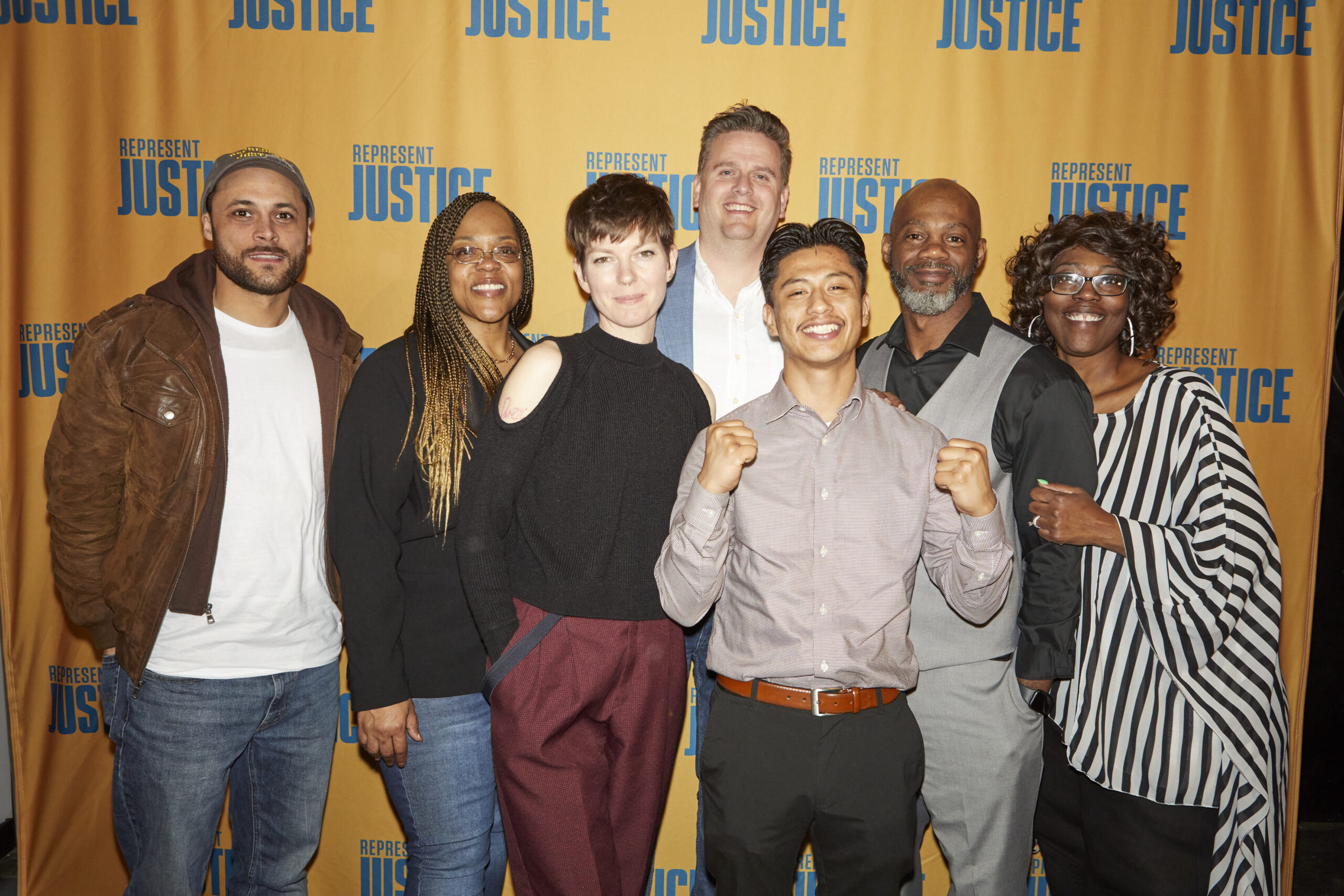 Seven Represent Justice Ambassadors pose for a picture